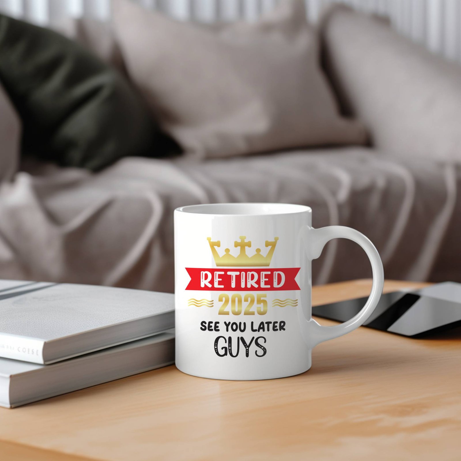 retired 2025 retirement mug gift on wooden table with couch in background
