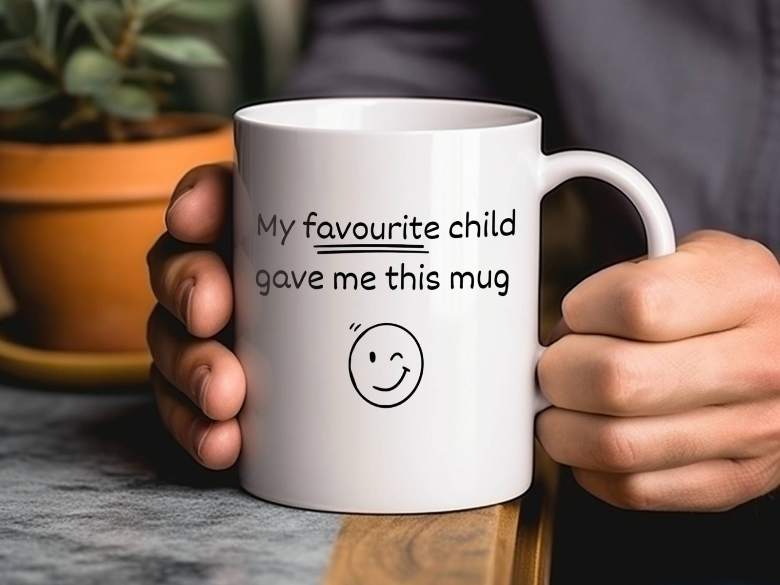gift for parent mug held in two hands by man with plants